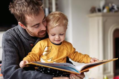 Father reading to son