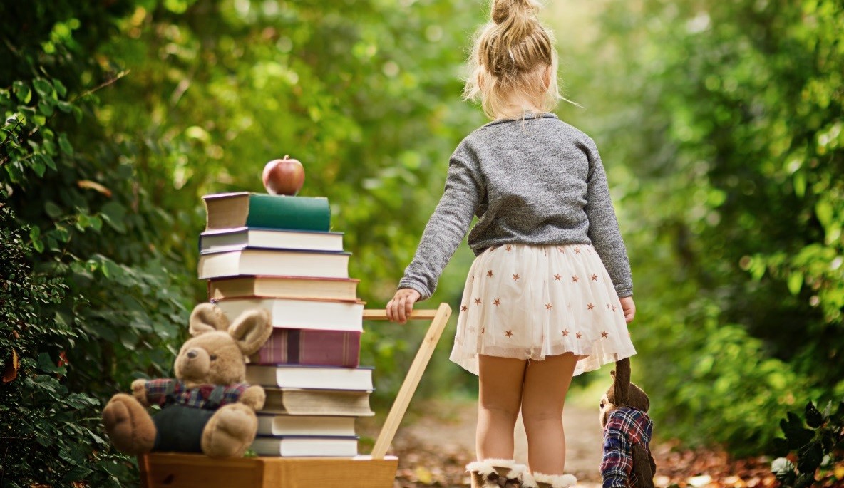 Girl with Wagon full of Books