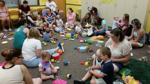Babies and Caregivers Playing